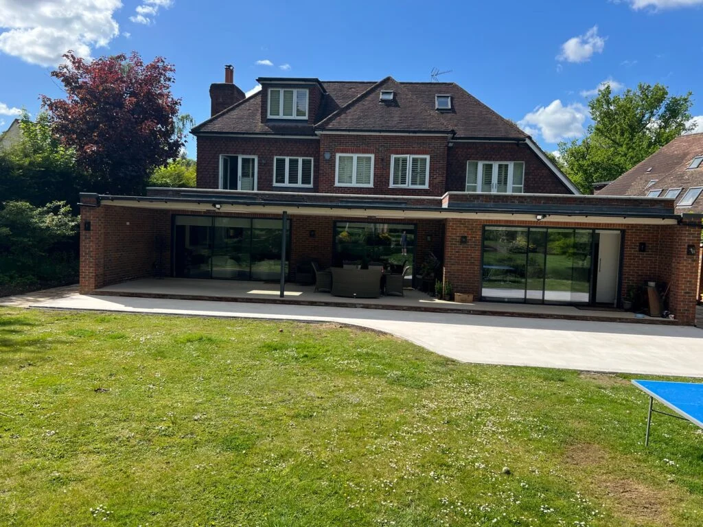 Meadway project in Oxshott, with a rear extension opening onto the garden